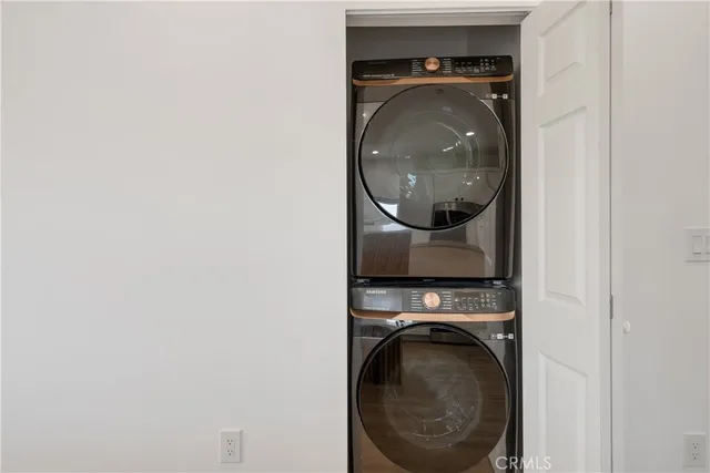 a bathroom with a double vanity sink toilet and shower