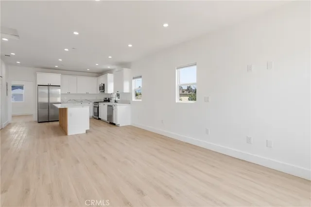 a view of kitchen with wooden floor