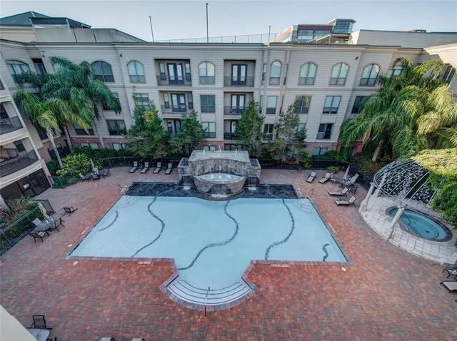 a view of a chairs and table in backyard
