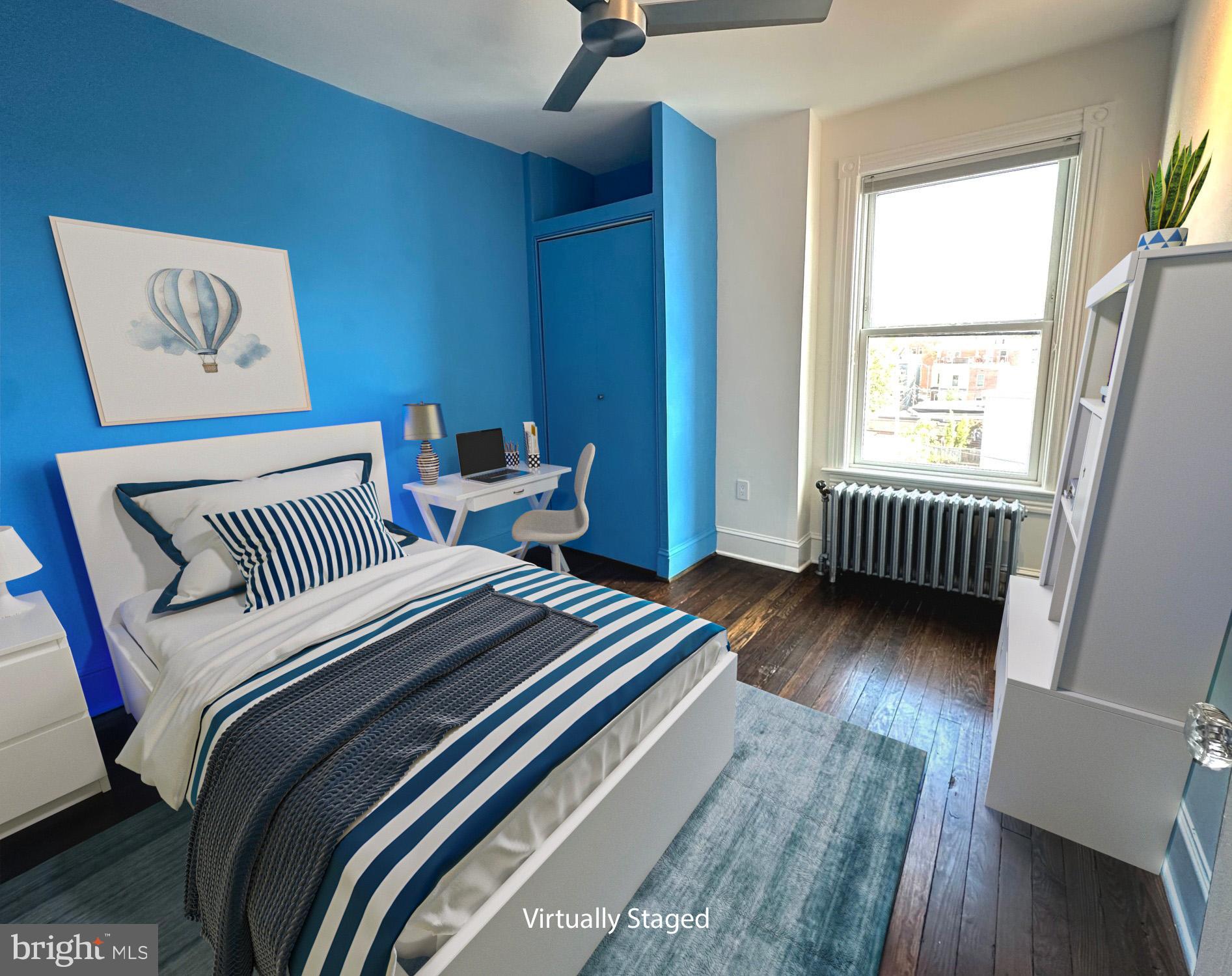 1903 4th Street Northwest Washington, DC 20001 - Photo 15 of 36 a bedroom with a bed and wooden floor