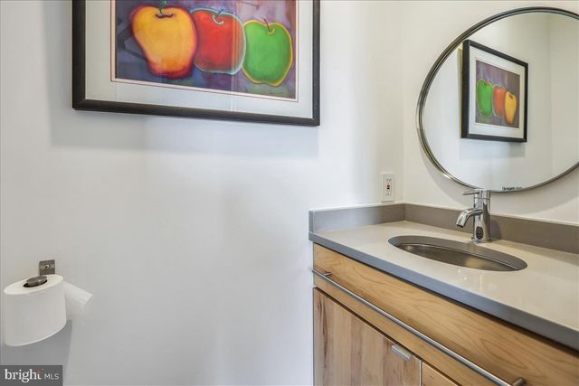 a living room with furniture a flat screen tv and a flat screen tv