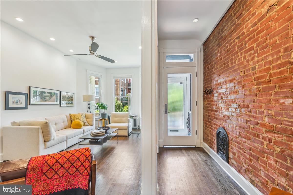 1903 4th Street Northwest Washington, DC 20001 - Photo 2 of 36 a living room with furniture and a fireplace