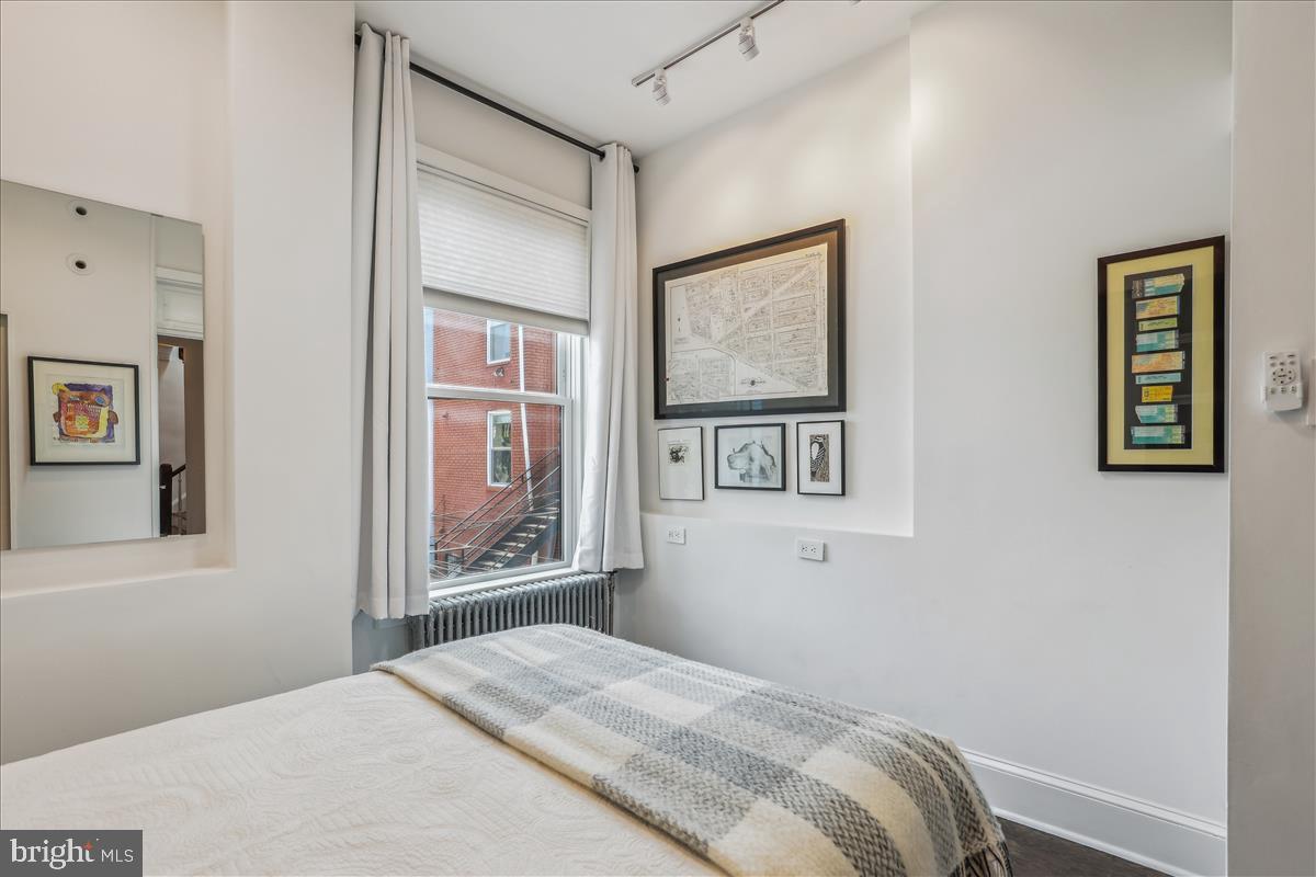 1903 4th Street Northwest Washington, DC 20001 - Photo 23 of 36 a bedroom with a bed and a window