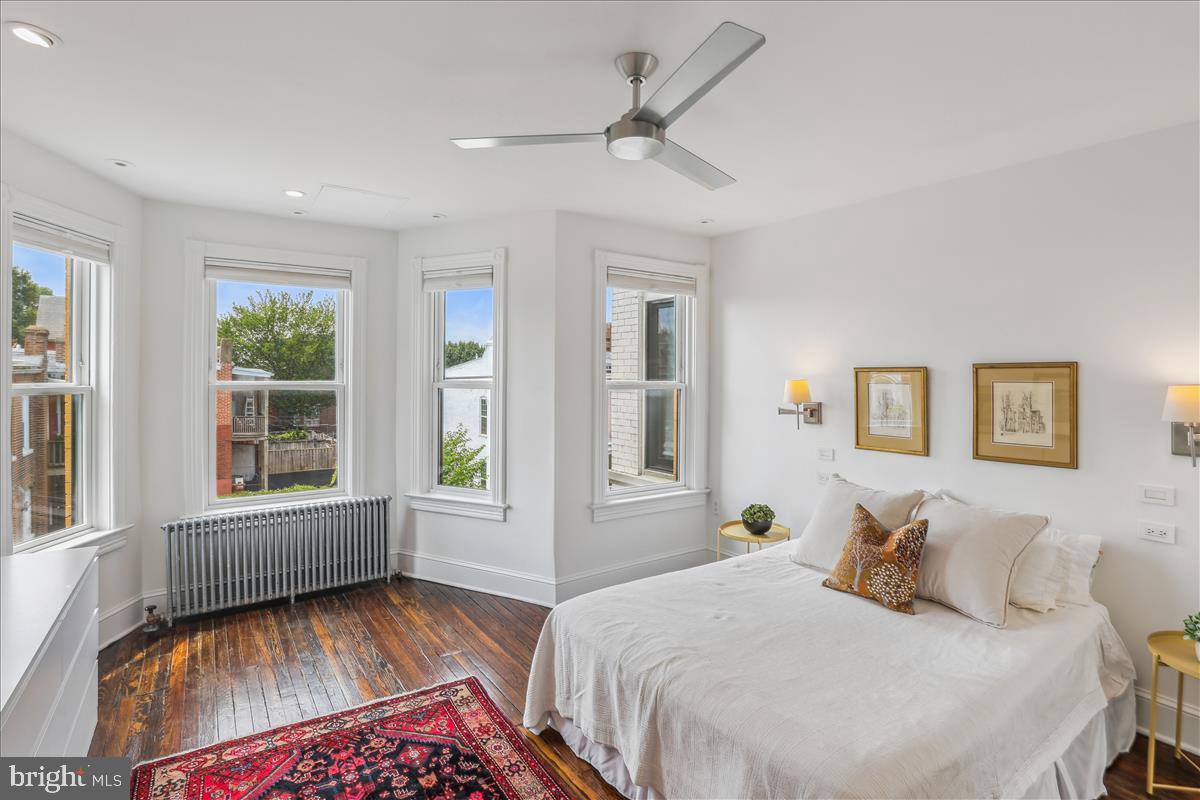 1903 4th Street Northwest Washington, DC 20001 - Photo 27 of 36 a bedroom with a bed and wooden floor