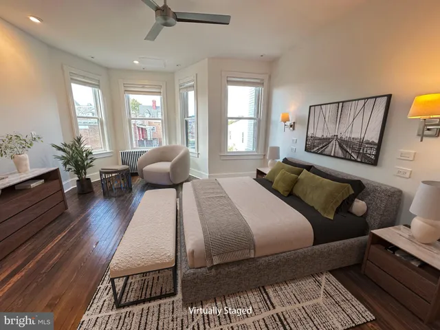 a view of a patio with a table and chairs under an umbrella