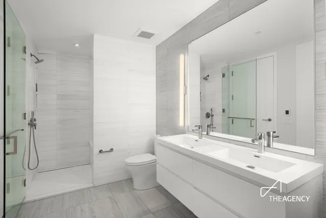 a bathroom with a bathtub a sink and a window