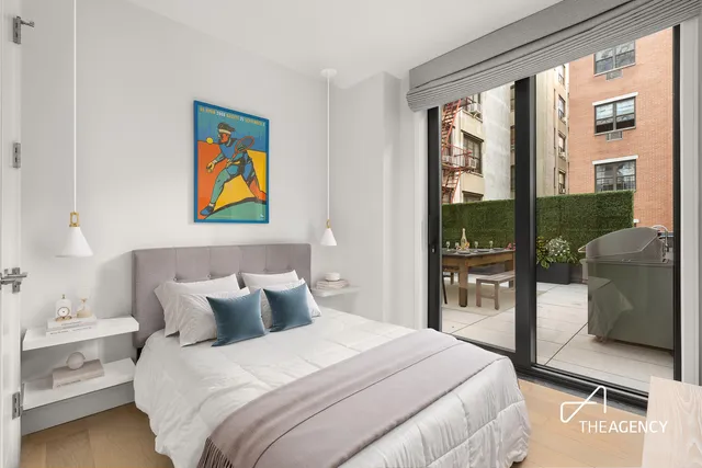 a bathroom with a double vanity sink toilet and shower