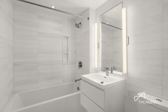 a bedroom with a bed and glass door