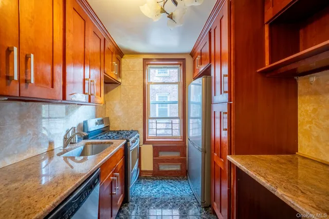a kitchen that has a sink and a stove