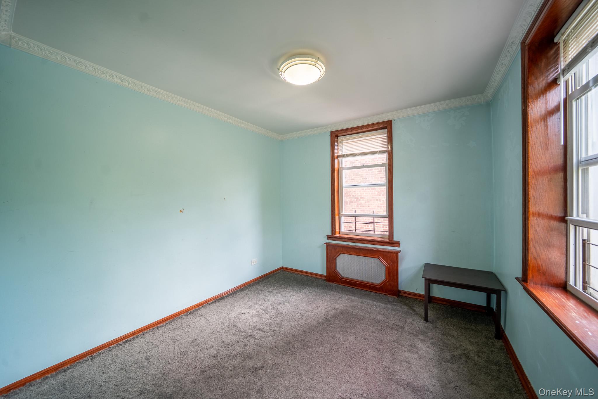 62-59 108th Street, Unit 4N Queens, NY 11375 - Photo 8 of 10 an empty room with windows