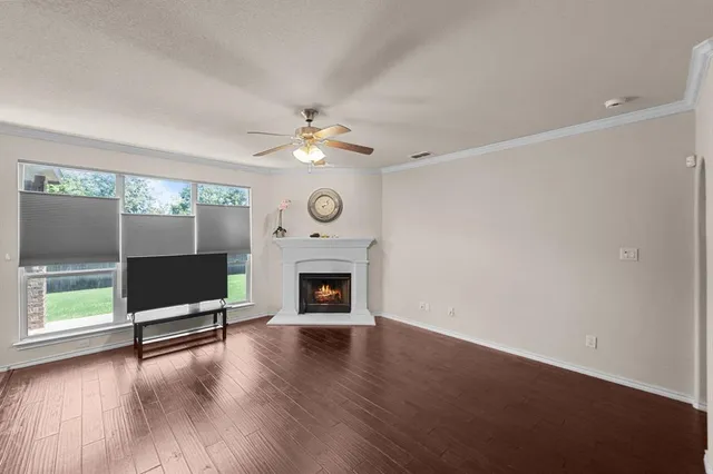 a living room with a fireplace furniture and a wooden floor