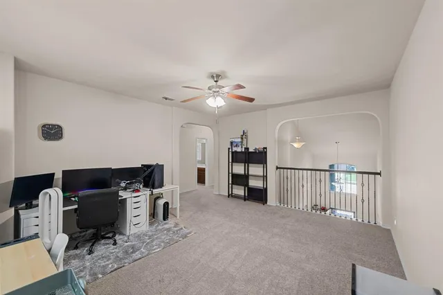 a view of a livingroom with furniture and a window