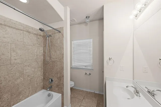 a bathroom with a double vanity sink a and a mirror