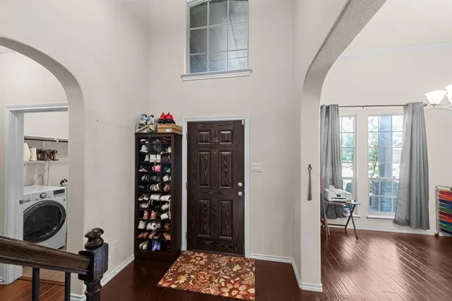 a view of entryway with wooden floor and furniture
