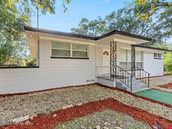 1330 Eddy Road Jacksonville, FL 32211 - Photo 1 of 39 a front view of a house with garden