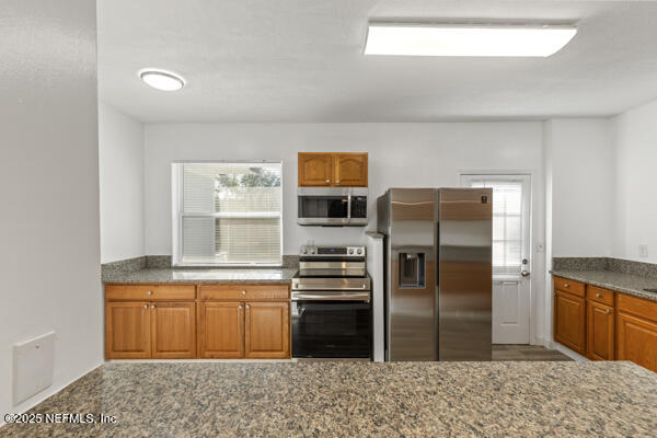 1330 Eddy Road Jacksonville, FL 32211 - Photo 17 of 39 a kitchen with a refrigerator and a sink
