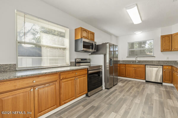 1330 Eddy Road Jacksonville, FL 32211 - Photo 18 of 39 a kitchen with stainless steel appliances granite countertop a stove and a sink