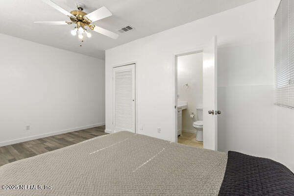 1330 Eddy Road Jacksonville, FL 32211 - Photo 26 of 39 a bedroom with a bed and a chandelier fan