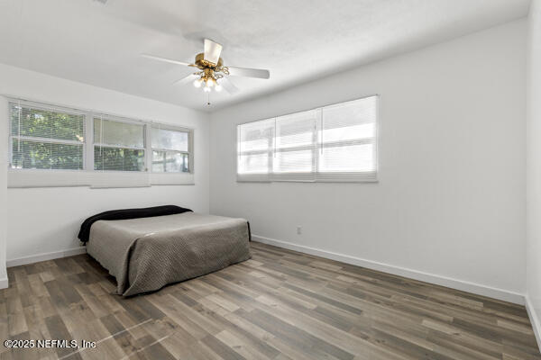 1330 Eddy Road Jacksonville, FL 32211 - Photo 28 of 39 a bedroom with a bed and a chandelier