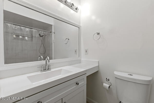 1330 Eddy Road Jacksonville, FL 32211 - Photo 30 of 39 a bathroom with a sink toilet and shower