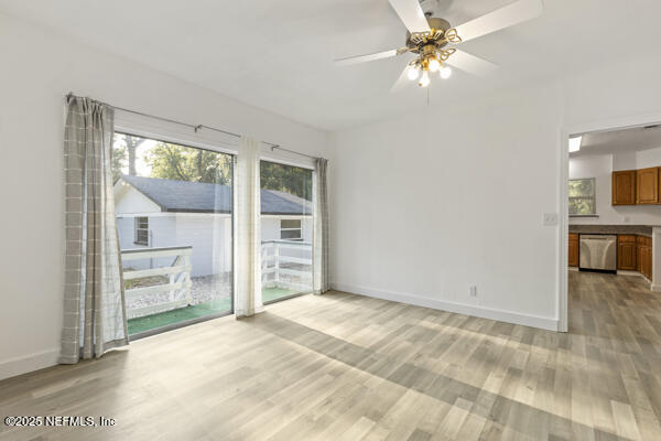 1330 Eddy Road Jacksonville, FL 32211 - Photo 32 of 39 a view of livingroom with furniture chandelier fan and window