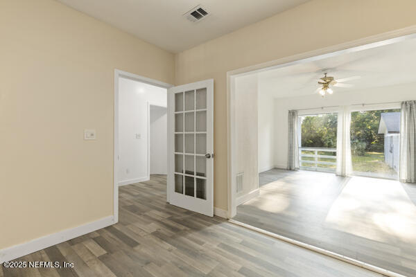 1330 Eddy Road Jacksonville, FL 32211 - Photo 33 of 39 an empty room with wooden floor and windows