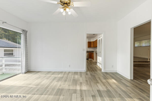 1330 Eddy Road Jacksonville, FL 32211 - Photo 34 of 39 a view of empty room with wooden floor and fan