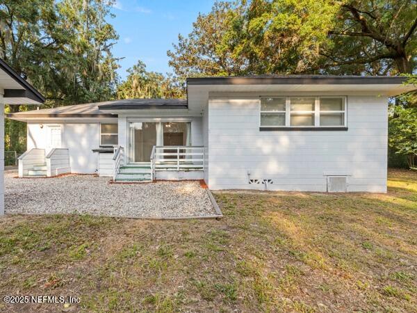 1330 Eddy Road Jacksonville, FL 32211 - Photo 5 of 39 front view of a house with a yard