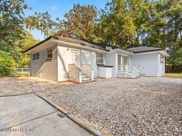 1330 Eddy Road Jacksonville, FL 32211 - Photo 6 of 39 a front view of a house with garden