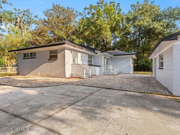 1330 Eddy Road Jacksonville, FL 32211 - Photo 10 of 39 a front view of house with yard and trees