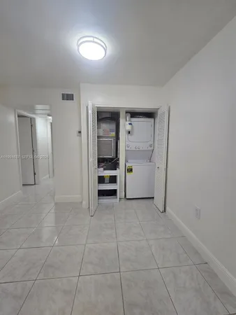 a view of a refrigerator and window