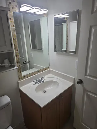 a bathroom with a shower a toilet and a shower