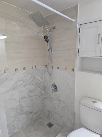 an empty room with a bathroom