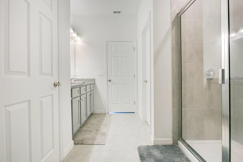 3964 Mayhill Loop Eustis, FL 32736 - Photo 16 of 34 a view of a hallway with wooden floor and staircase