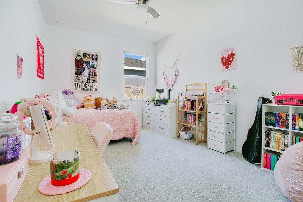 3964 Mayhill Loop Eustis, FL 32736 - Photo 19 of 34 a bed room with a bed and a couch