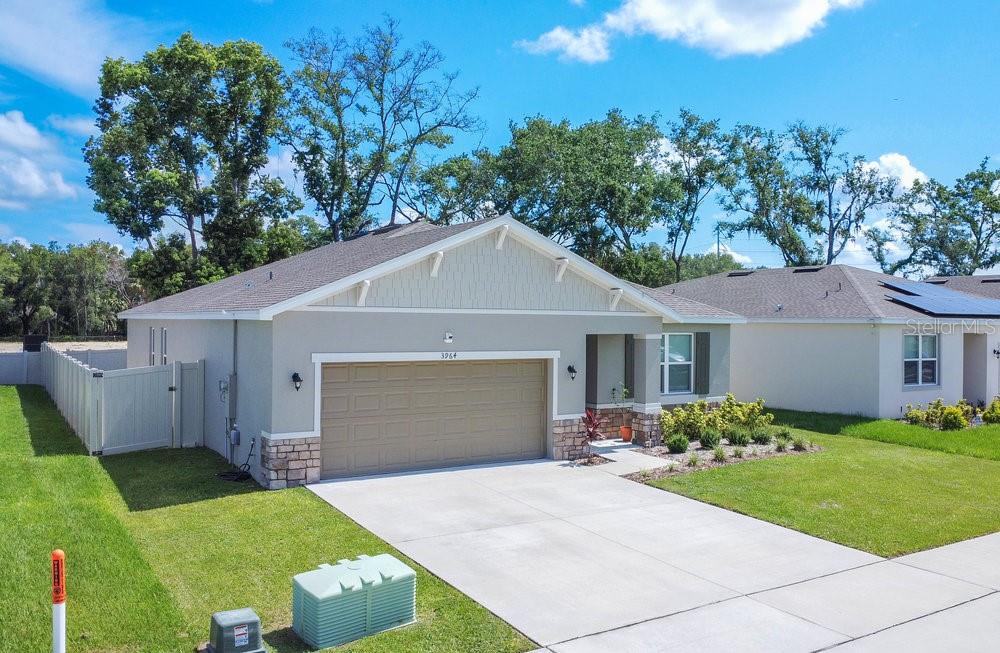 3964 Mayhill Loop Eustis, FL 32736 - Photo 2 of 34 a front view of house with yard and green space
