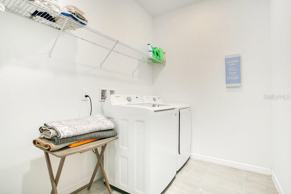 3964 Mayhill Loop Eustis, FL 32736 - Photo 23 of 34 a utility room with washer and dryer