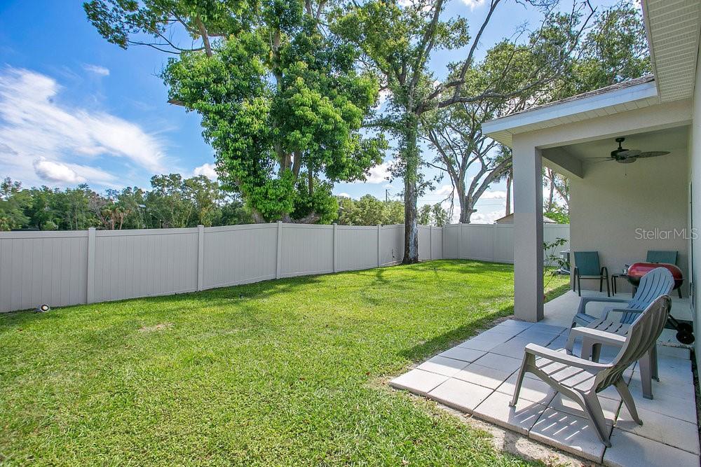 3964 Mayhill Loop Eustis, FL 32736 - Photo 24 of 34 a view of backyard with seating and green space