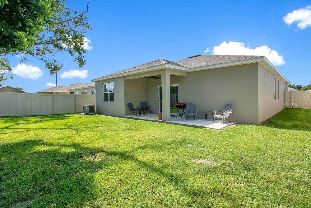3964 Mayhill Loop Eustis, FL 32736 - Photo 25 of 34 a front view of a house with garden