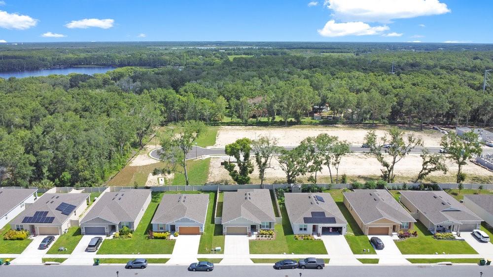 3964 Mayhill Loop Eustis, FL 32736 - Photo 30 of 34 an aerial view of residential houses with outdoor space and swimming pool