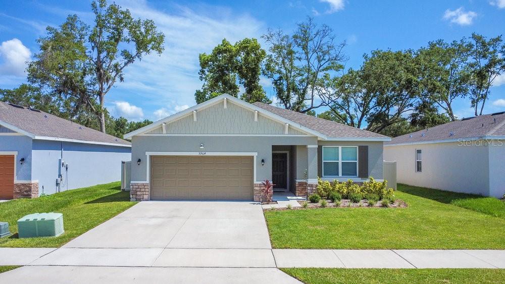 3964 Mayhill Loop Eustis, FL 32736 - Photo 3 of 34 a front view of house with yard and green space