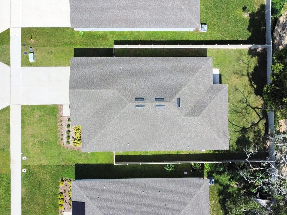 3964 Mayhill Loop Eustis, FL 32736 - Photo 32 of 34 an aerial view of a house with a yard