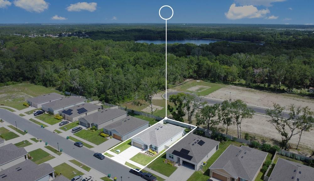 3964 Mayhill Loop Eustis, FL 32736 - Photo 34 of 34 aerial view of a house with a garden