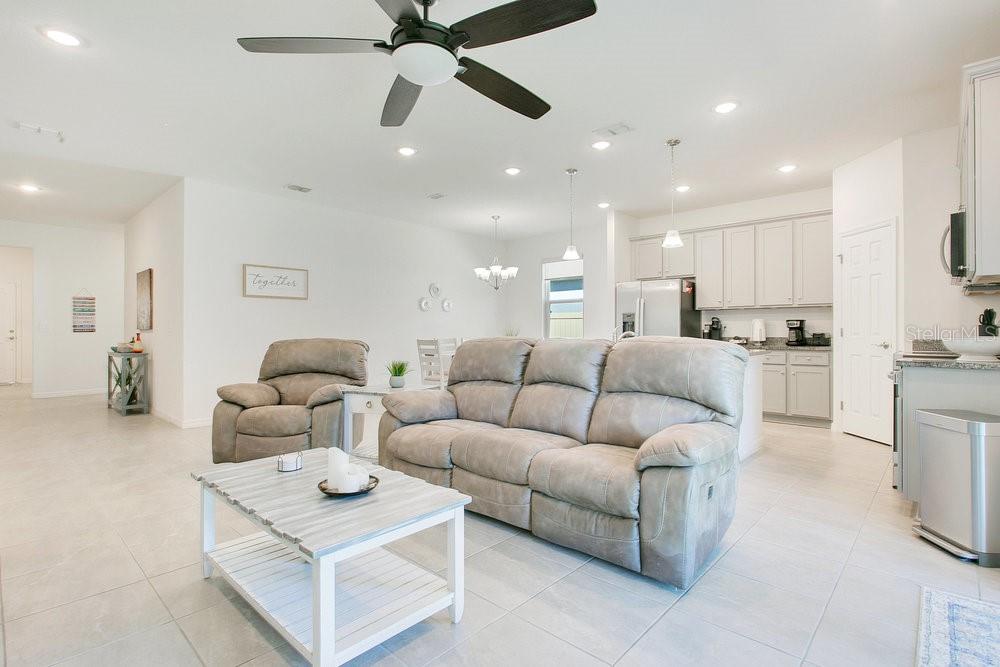 3964 Mayhill Loop Eustis, FL 32736 - Photo 6 of 34 a living room with furniture and kitchen view