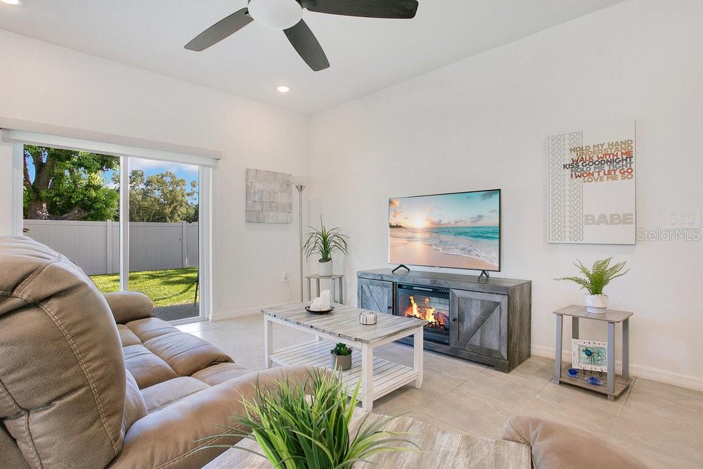 3964 Mayhill Loop Eustis, FL 32736 - Photo 8 of 34 a living room with furniture and a flat screen tv
