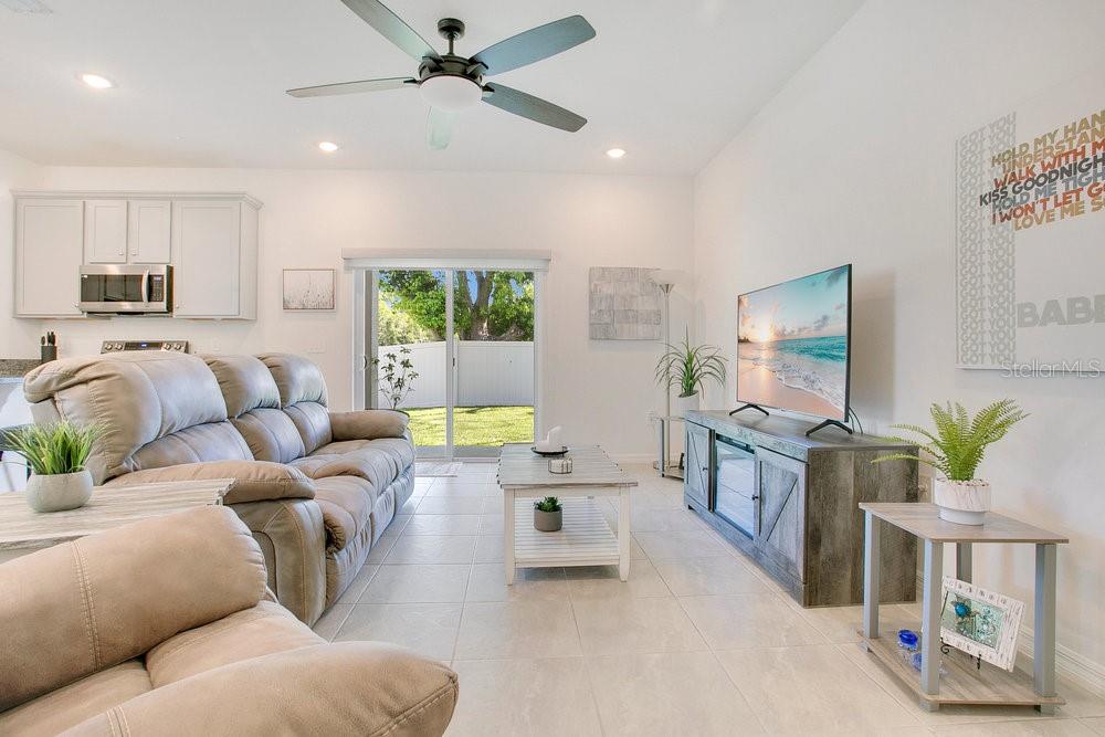 3964 Mayhill Loop Eustis, FL 32736 - Photo 9 of 34 a living room with furniture and a flat screen tv