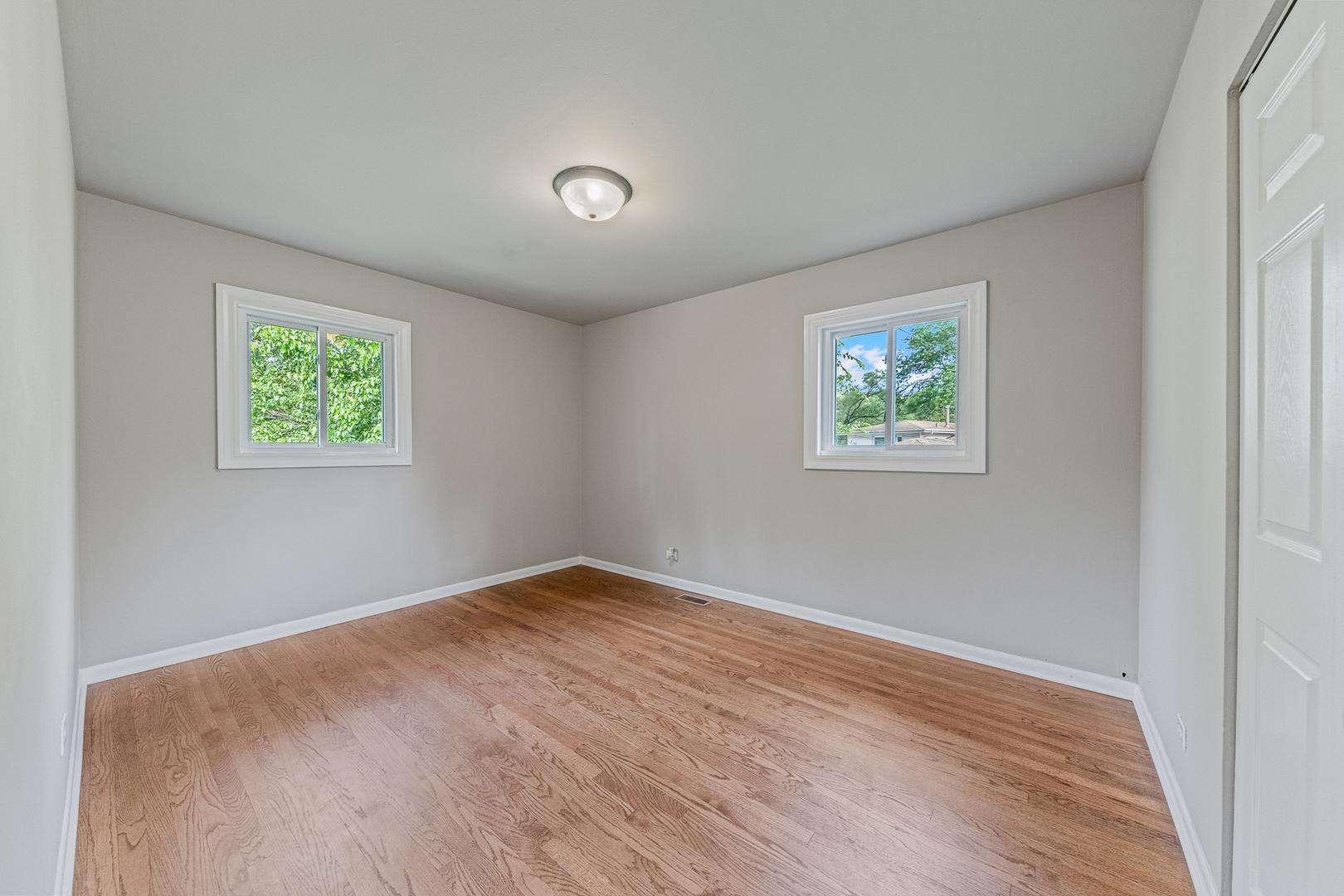 303 Springfield Street Park Forest, IL 60466 - Photo 9 of 16 an empty room with windows