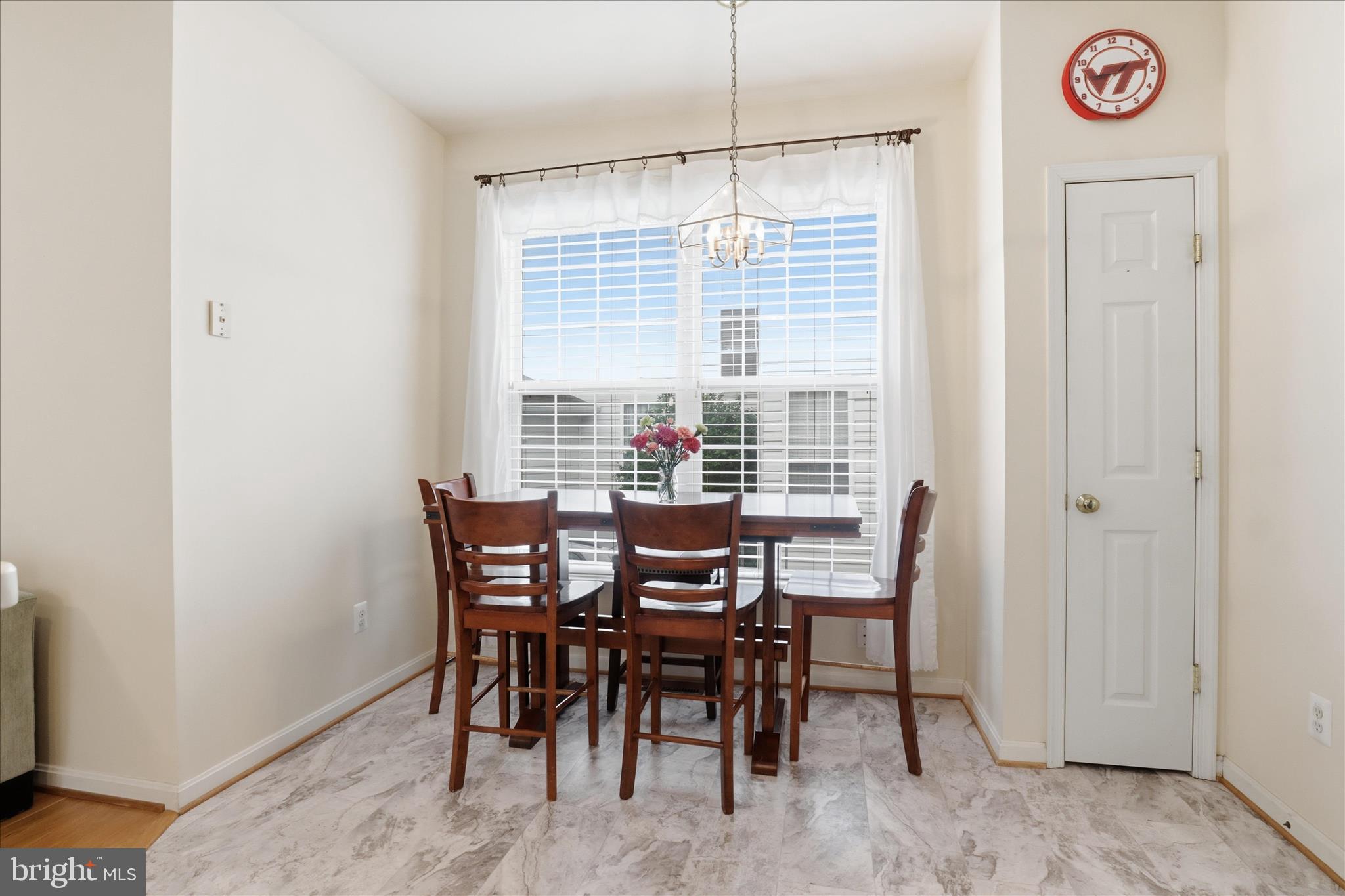 25352 Ripleys Field Drive Chantilly, VA 20152 - Photo 7 of 54 a view of a dining room with furniture window and outside view