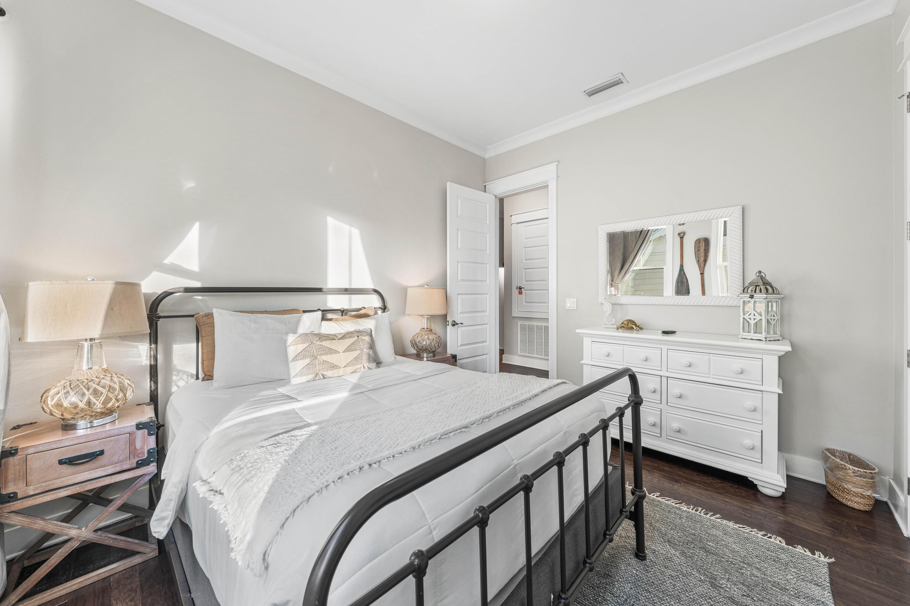 91 Milestone Dr Inlet Beach, Unit B Inlet Beach, FL 32461 - Photo 22 of 51 a bedroom with a bed and a table