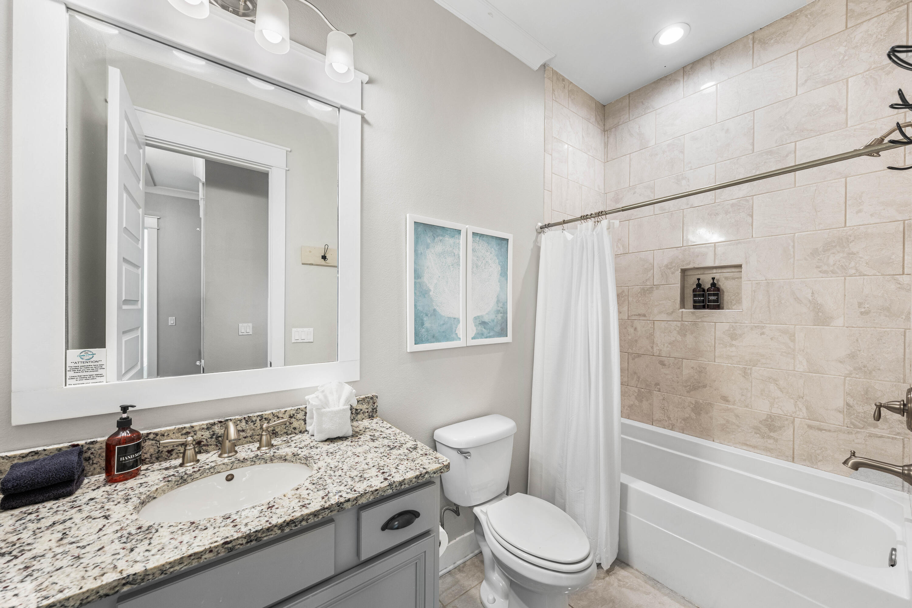 91 Milestone Dr Inlet Beach, Unit B Inlet Beach, FL 32461 - Photo 25 of 51 a bathroom with a granite countertop sink toilet and shower